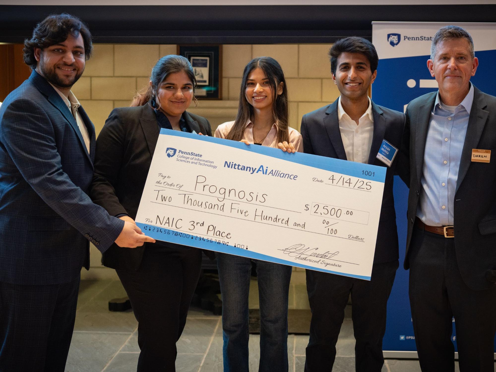 college students display giant check