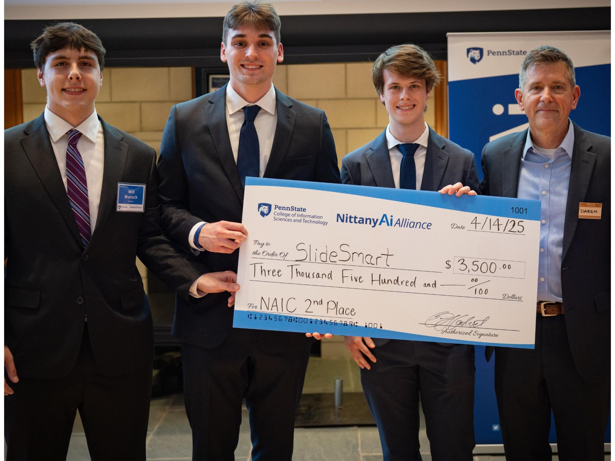 college students display giant check