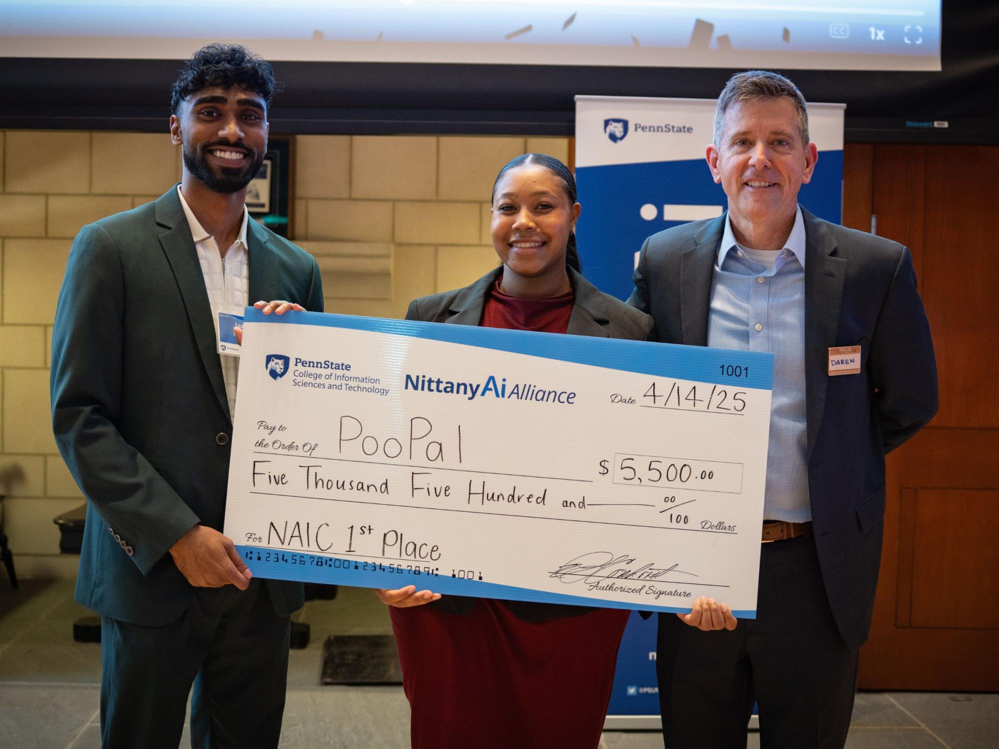 college students display giant check