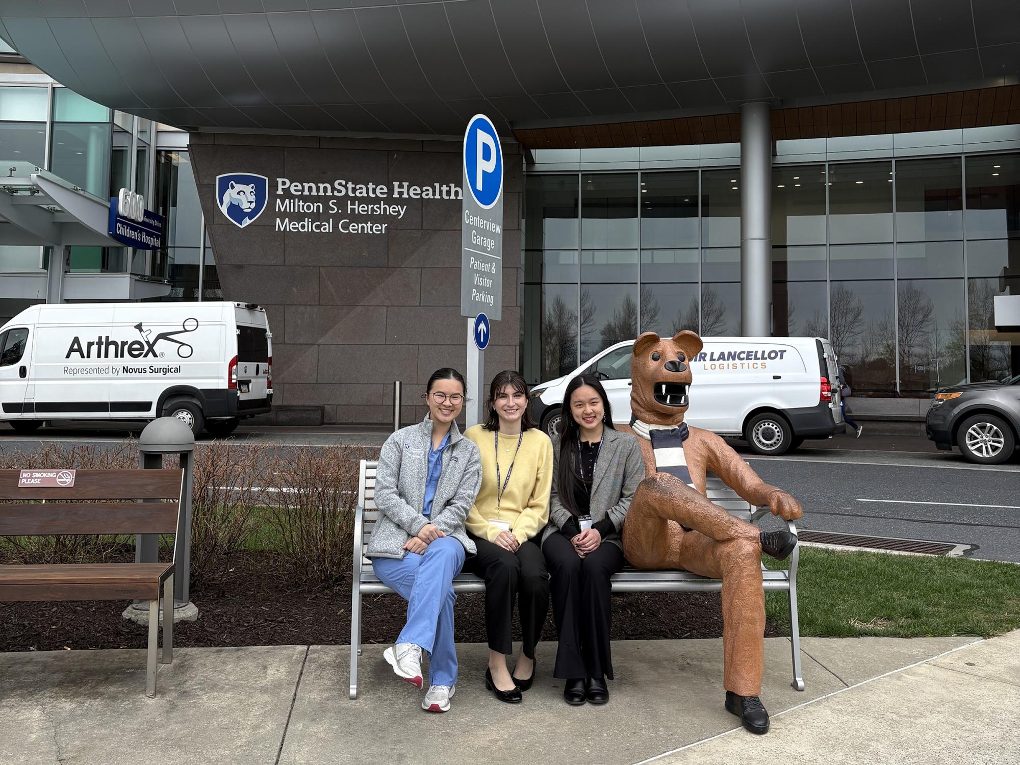 Schreyer Med Team students pose with the Nittany Lion statue