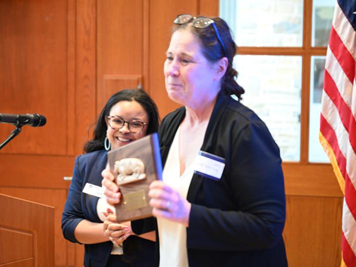 Rayne Sperling receives the Service to Penn State Award from presenter Krishawna Goins.