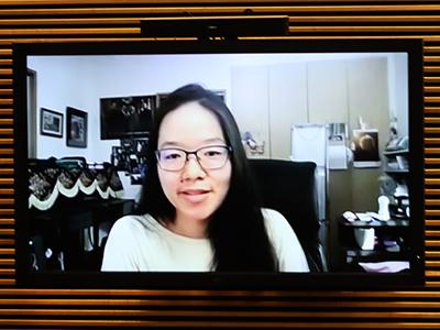 A woman on a TV screen.