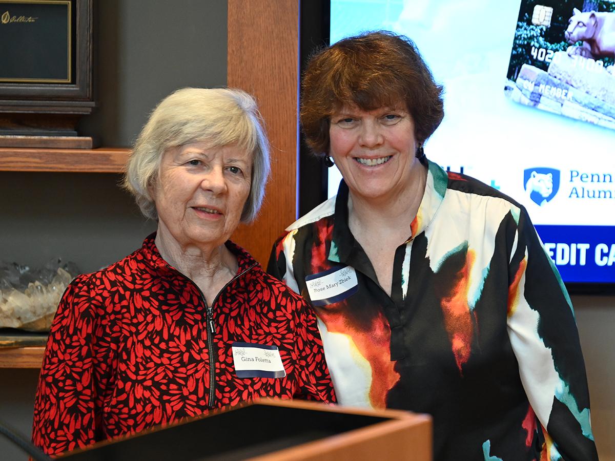 Rose Mary Zbiek receives an award from presenter Gina Foletta.
