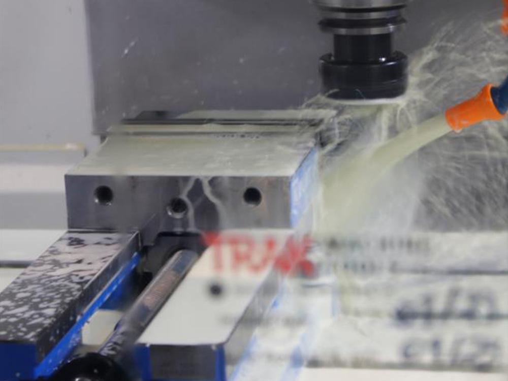 Water is sprayed on a racecar part.  