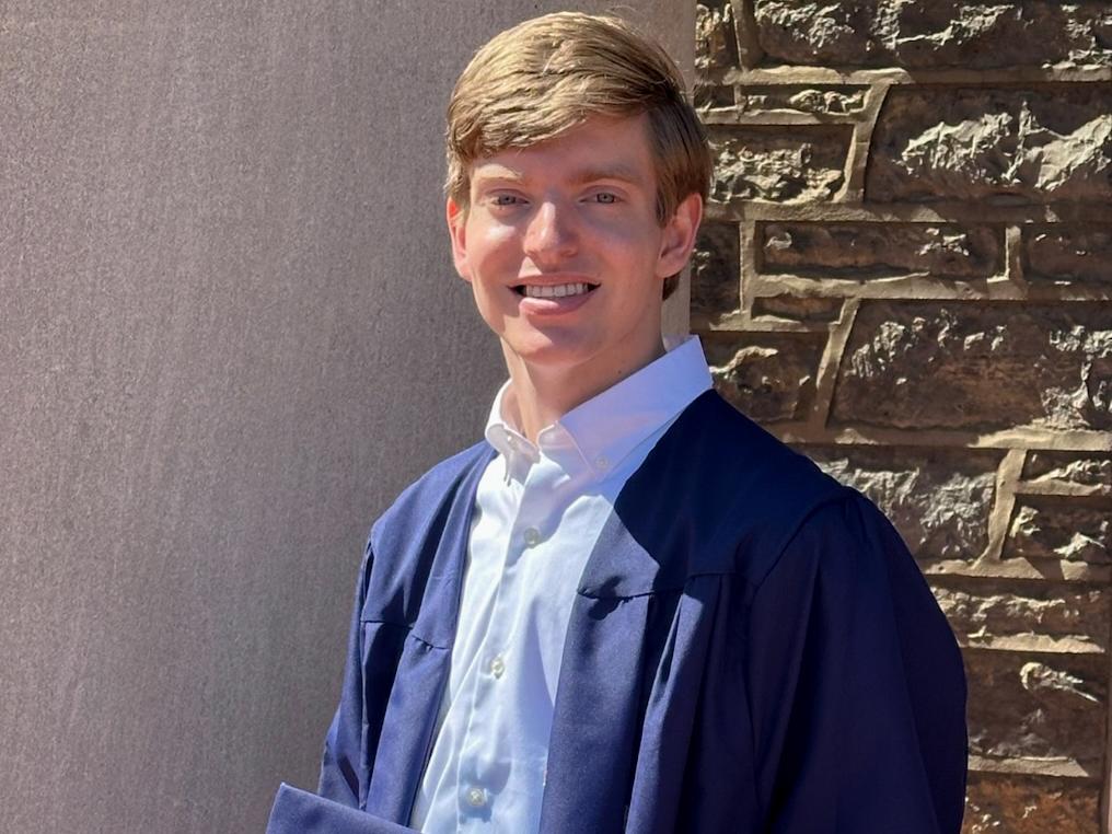 Noel’s recent graduation picture taken in front of Penn State’s Old Main.