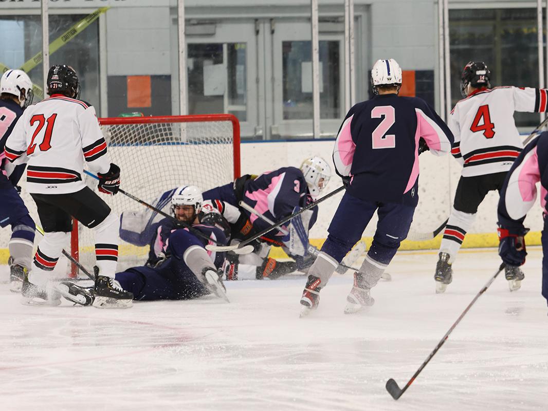 Roan McCormick and Jake Fabricant fight at the net at a home game against California University.