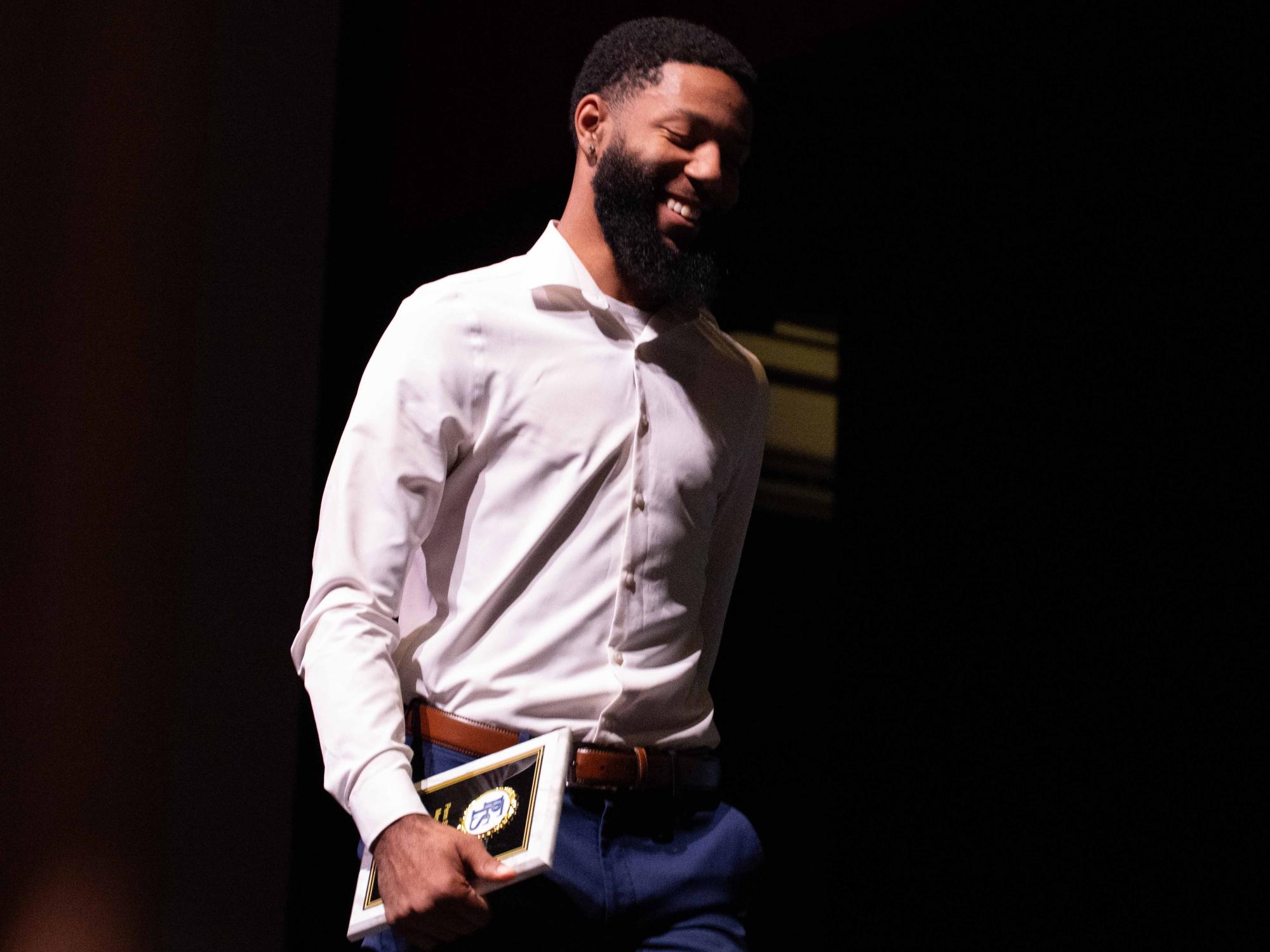 Dasilas Jones smiles while walking off stage after receiving the All-Time Leading Scorer award for Men’s Basketball at Penn State Fayette.