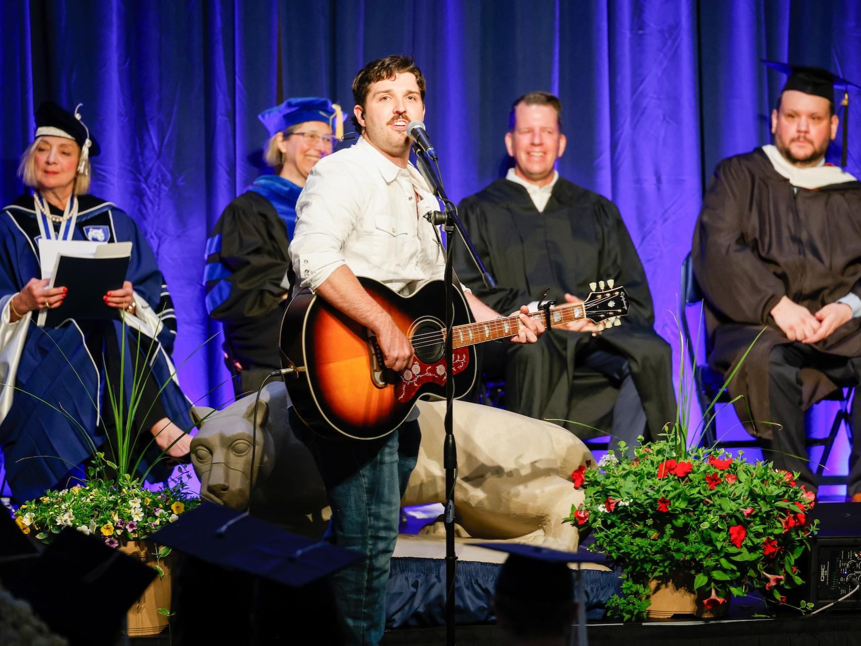Michael DeGirolamo singing at commencement