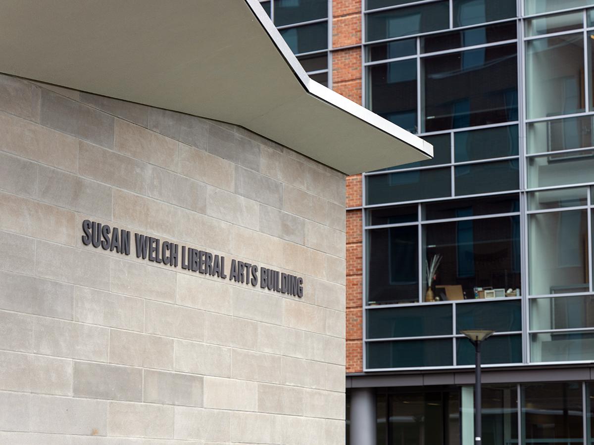 Photo of name of Susan Welch Liberal Arts Building on building exterior