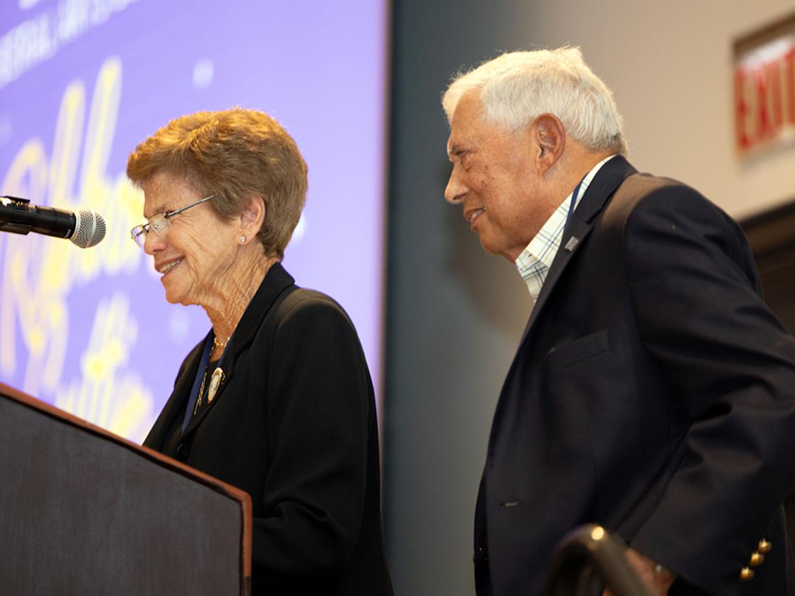 Roz and Gene Chaiken at podium during Susan Welch Liberal Arts Building ceremony