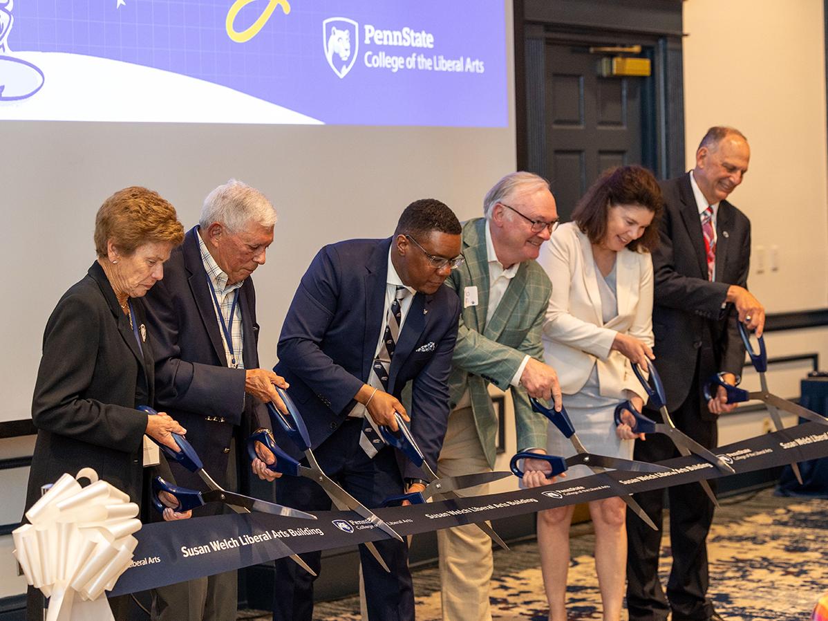 Welch Ribbon Cutting speakers cutting ribbon at end of ceremony