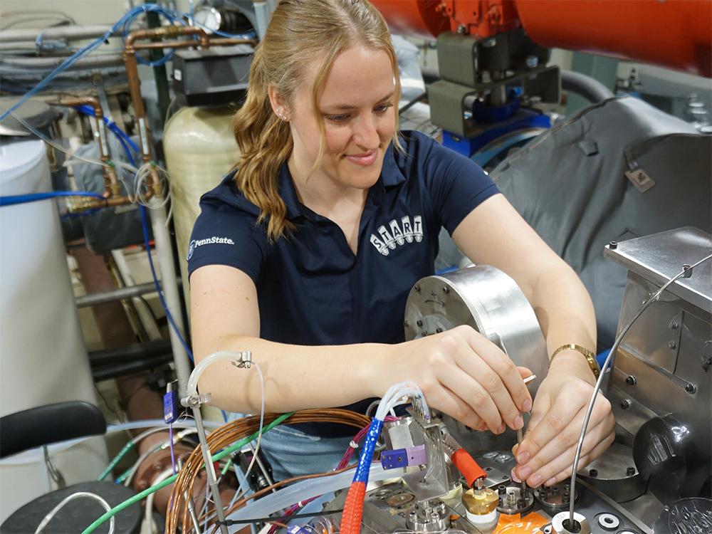 Person in lab putting probes on machine