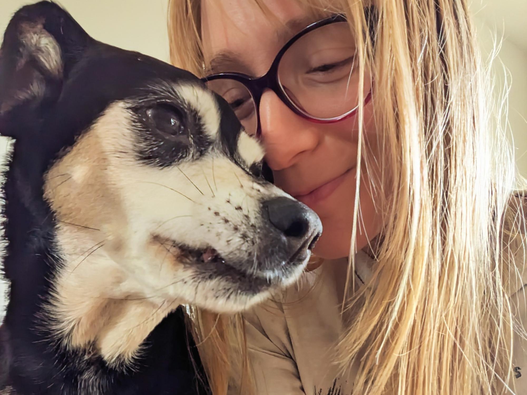 Jessie Wolfen nuzzles her dog, Maddie.