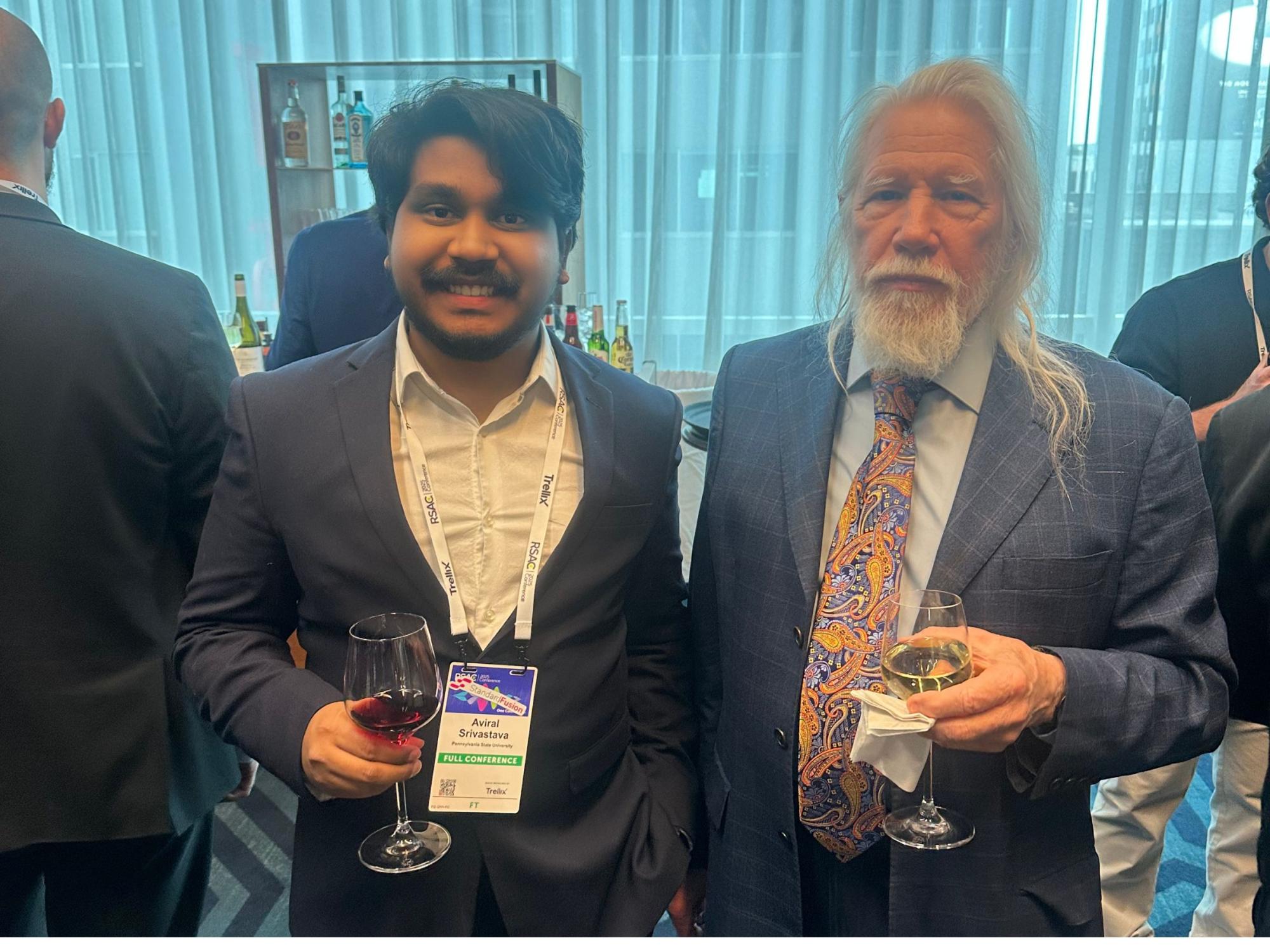 two people with cocktails at industry conference