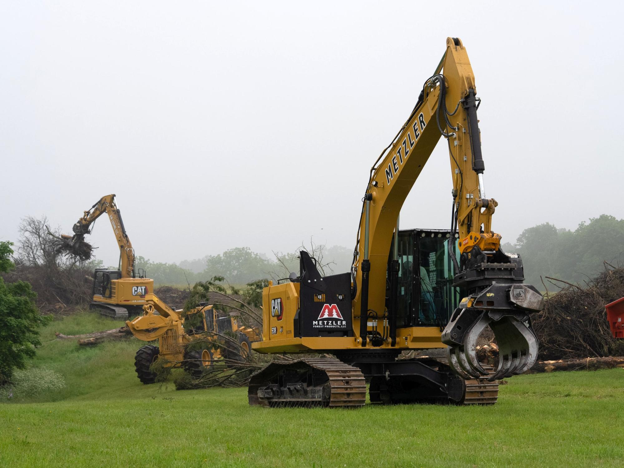 Log loaders are demonstrated at the Timber 2025 expo