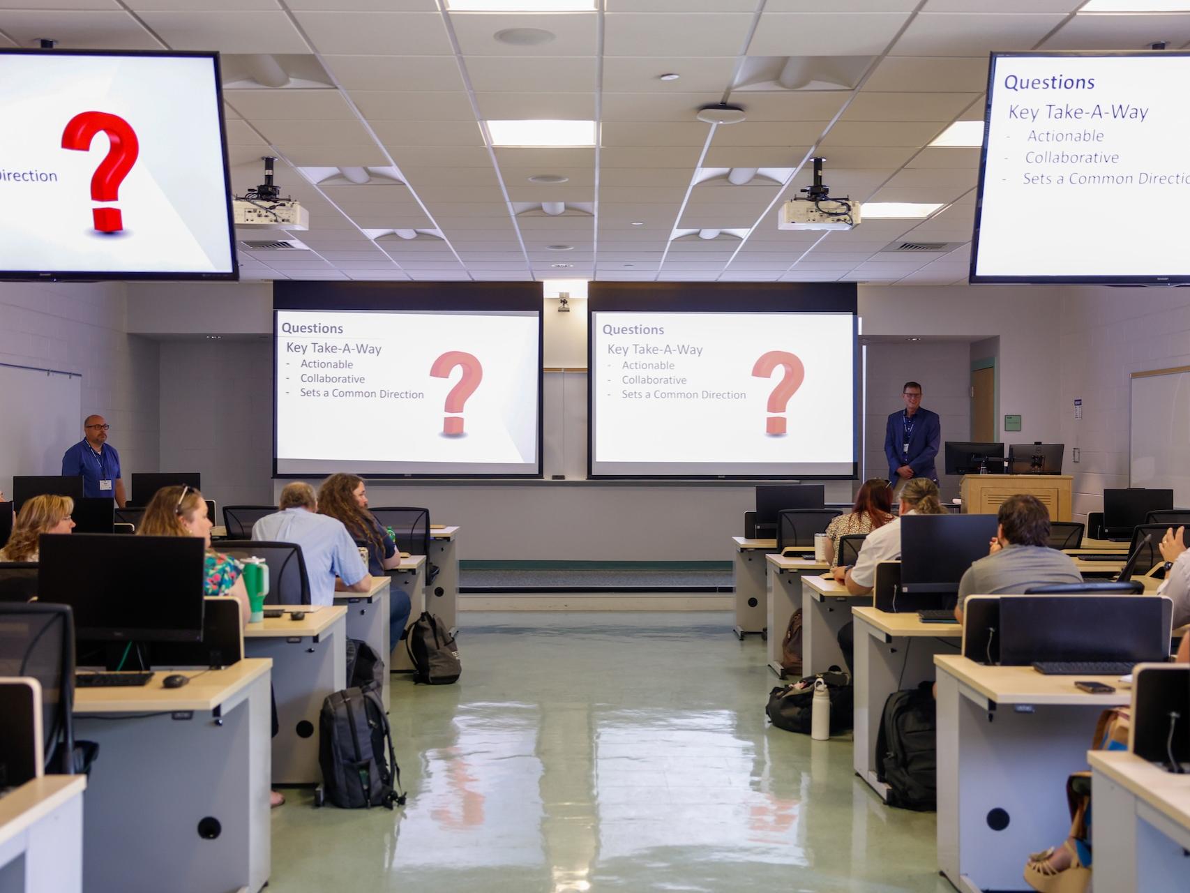 people speaking in classroom