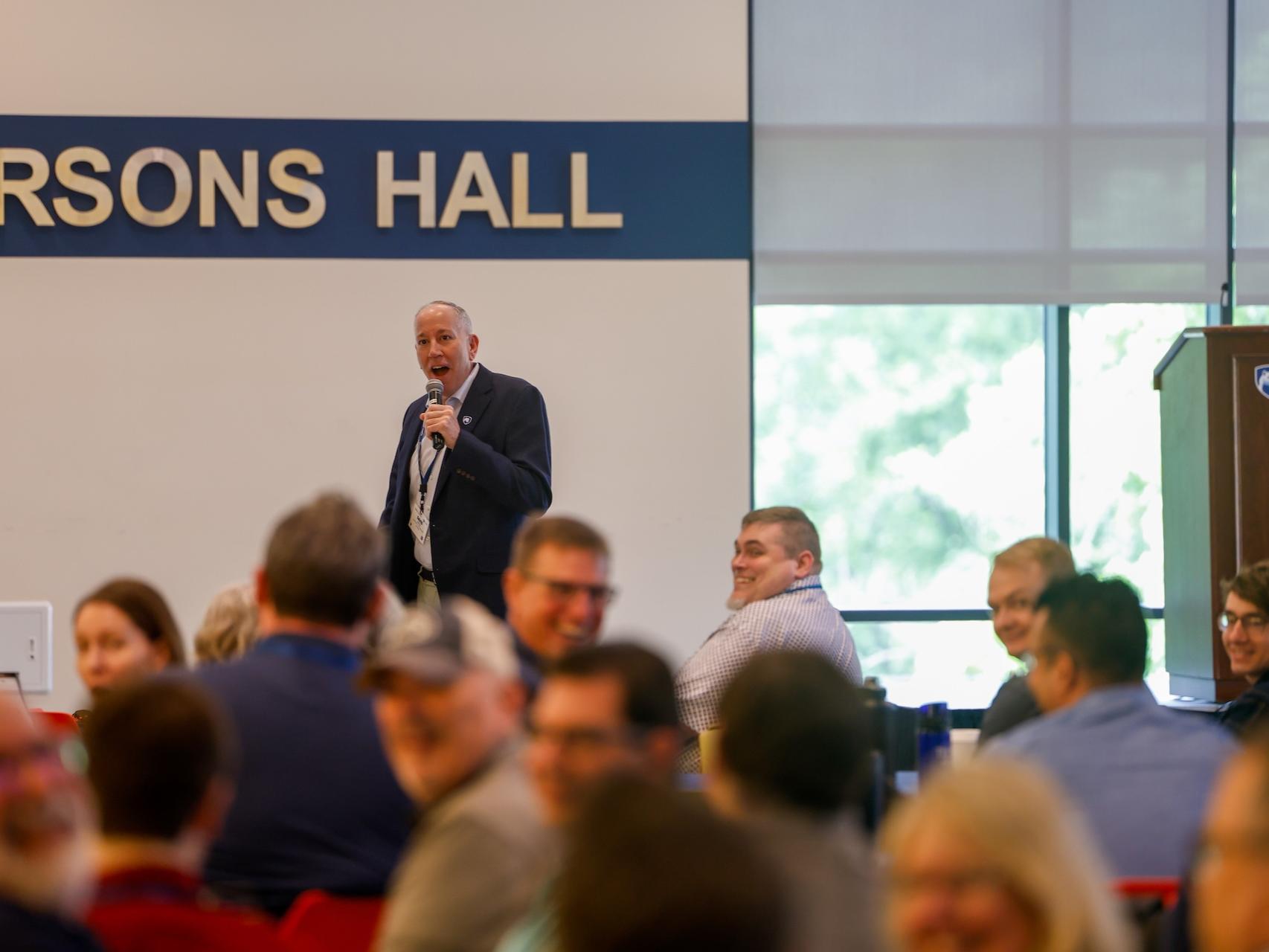 man speaking to audience
