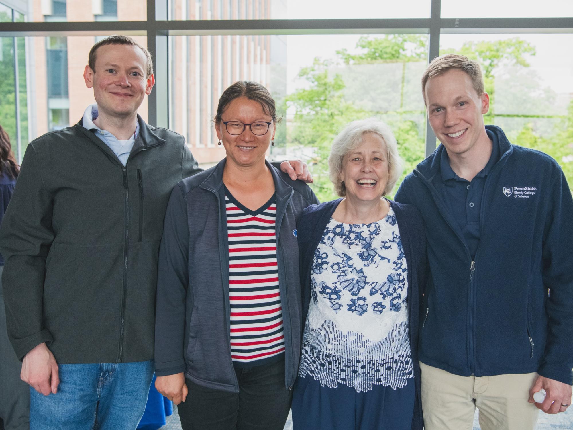 Group of Penn State faculty members posing for a photo with Jackie Bortiatynski.