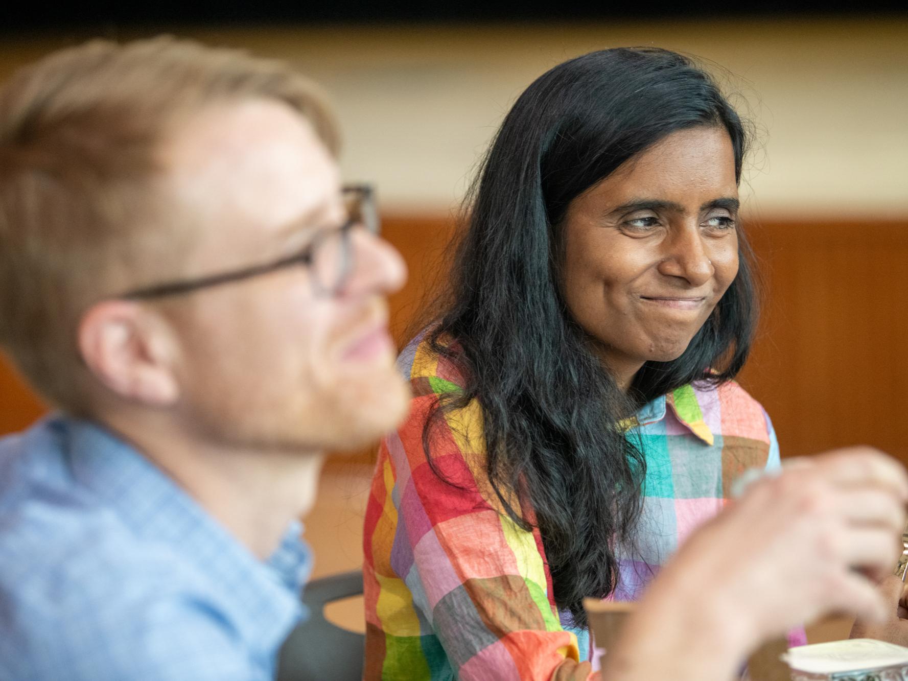 Two people sitting at a table at the World Cafe. 