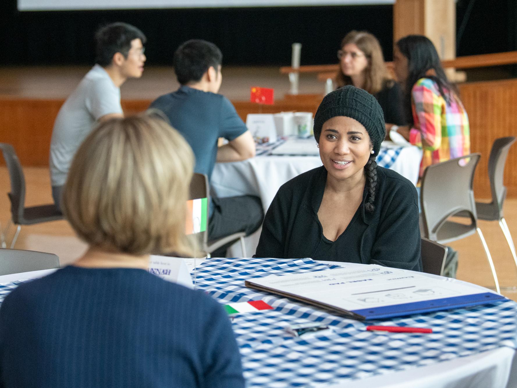 Person sitting at a table at the World Cafe.