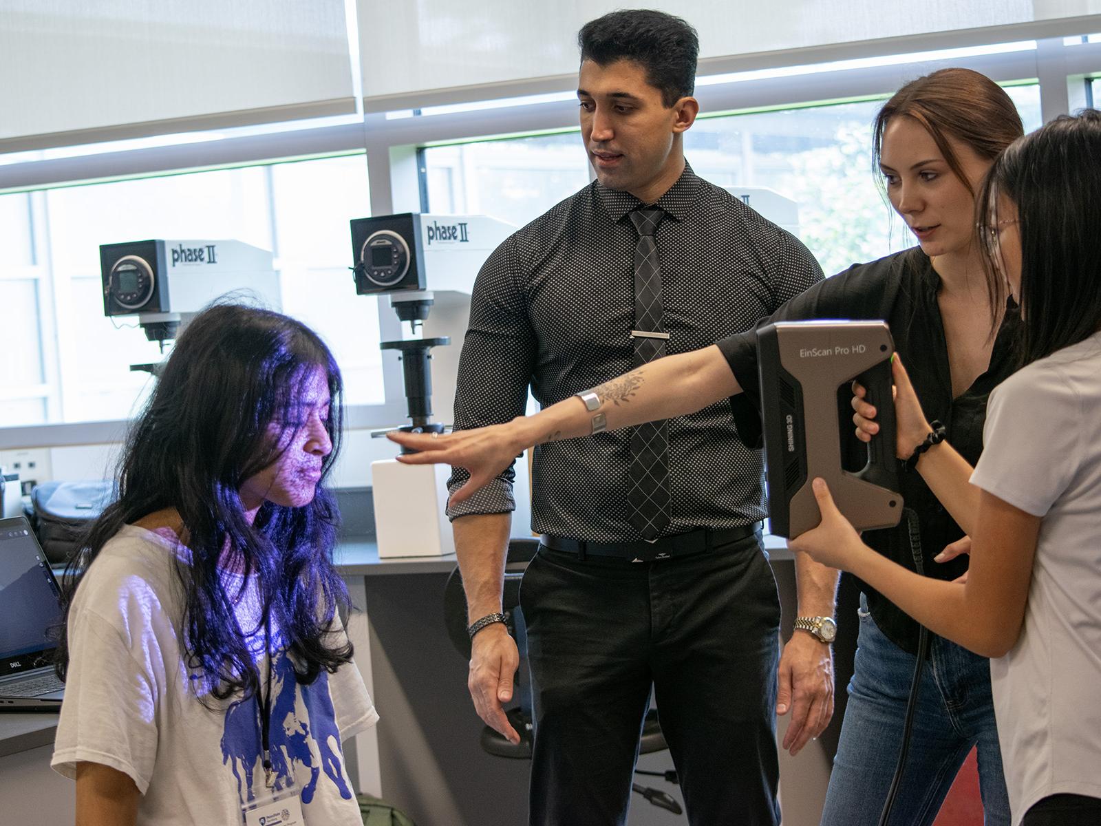 Students use a 3D Scanning device in a lab