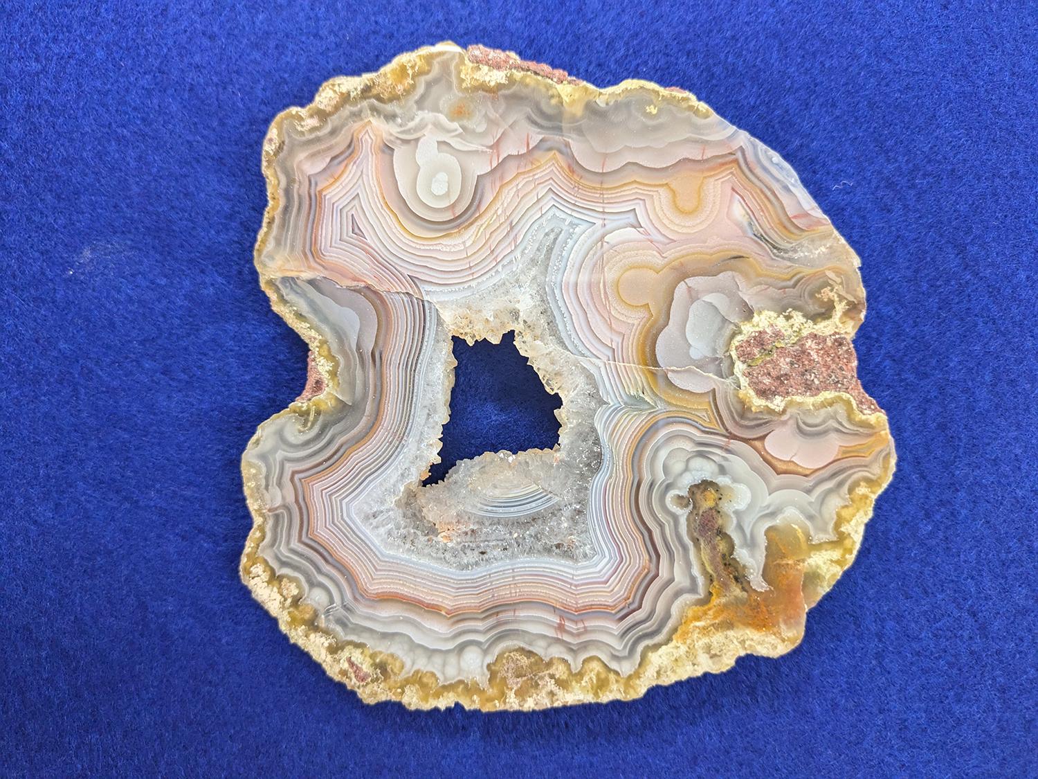 Sample of chalcedony, an agate with parallel banding.