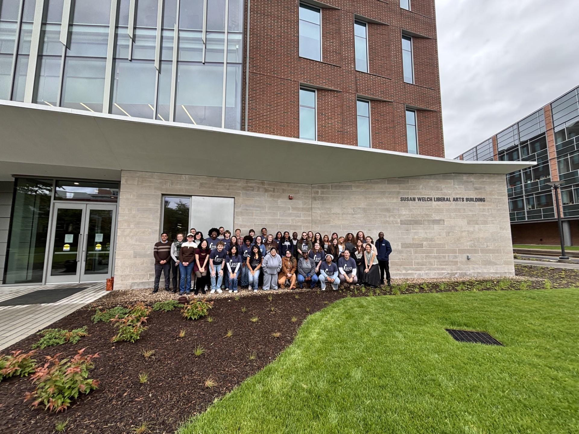 Students gather outside the Susan Welch Liberal Arts Building 