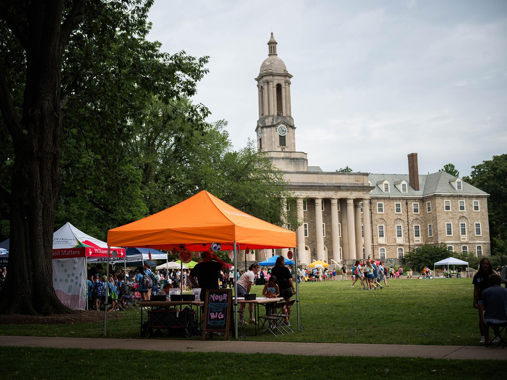 Tents set up on the lawn of Old Main at University Park