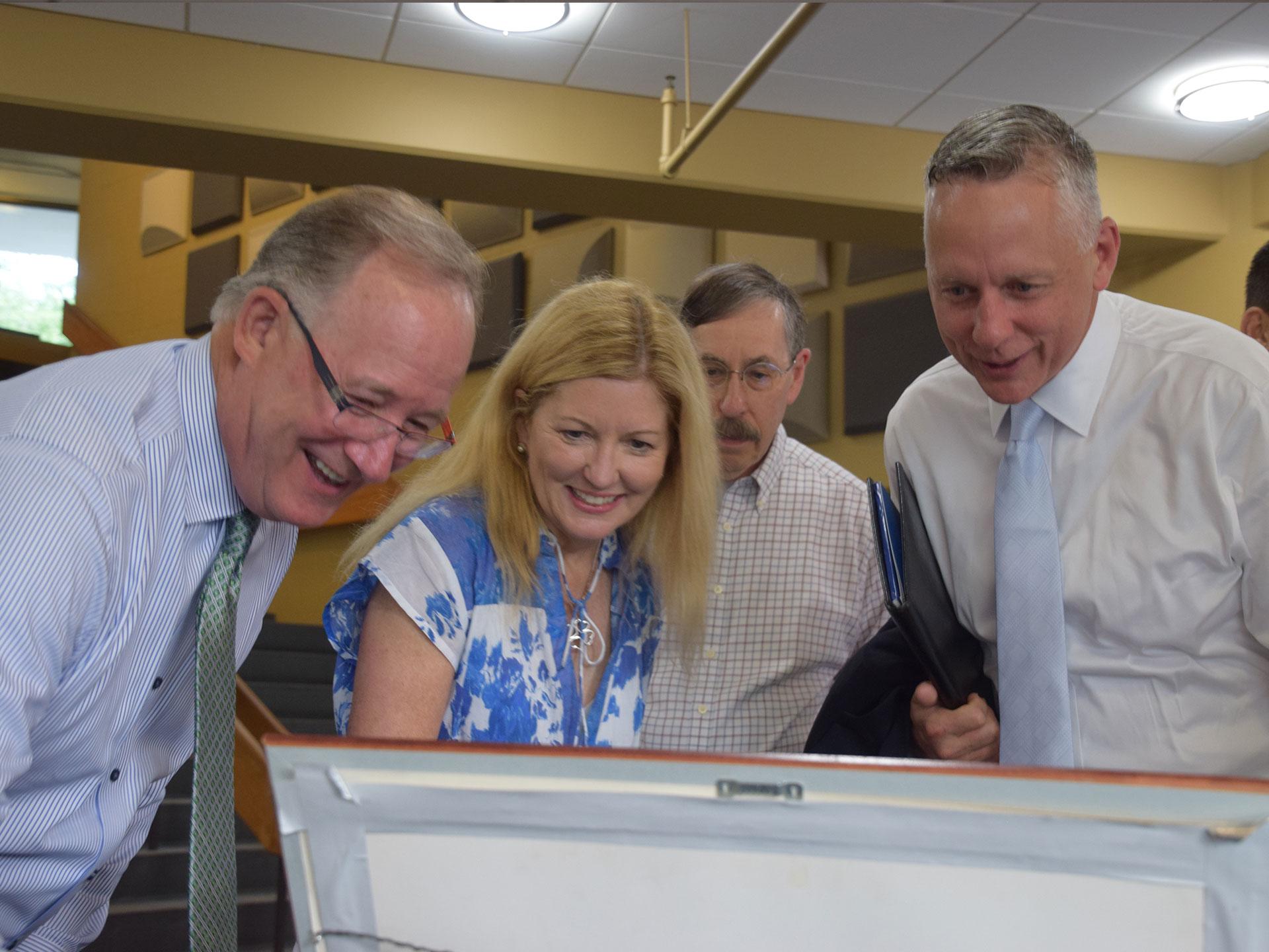 People looking at documents