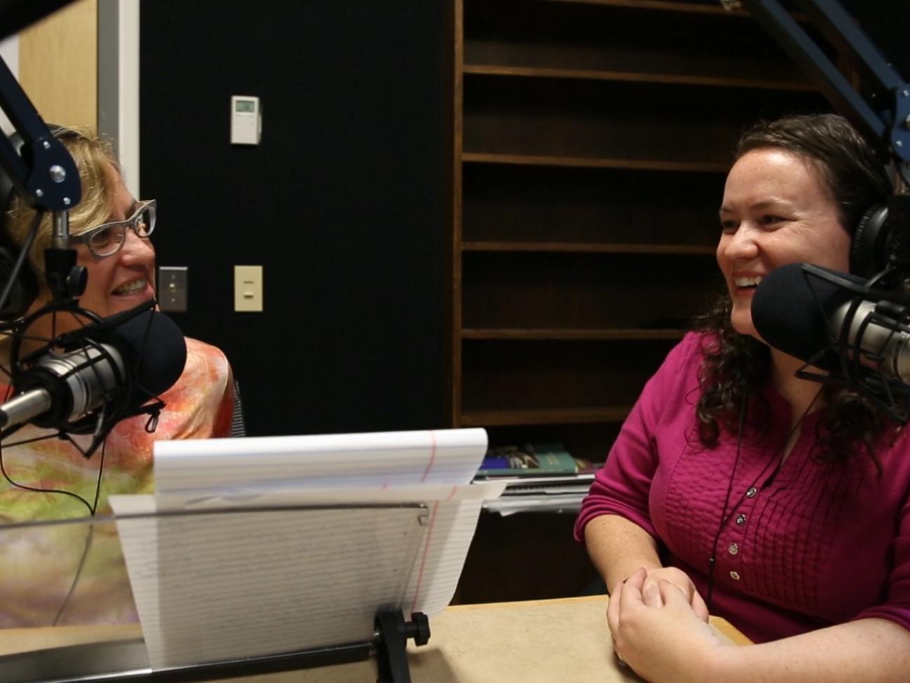 Radio reporter interviewing someone in the studio.