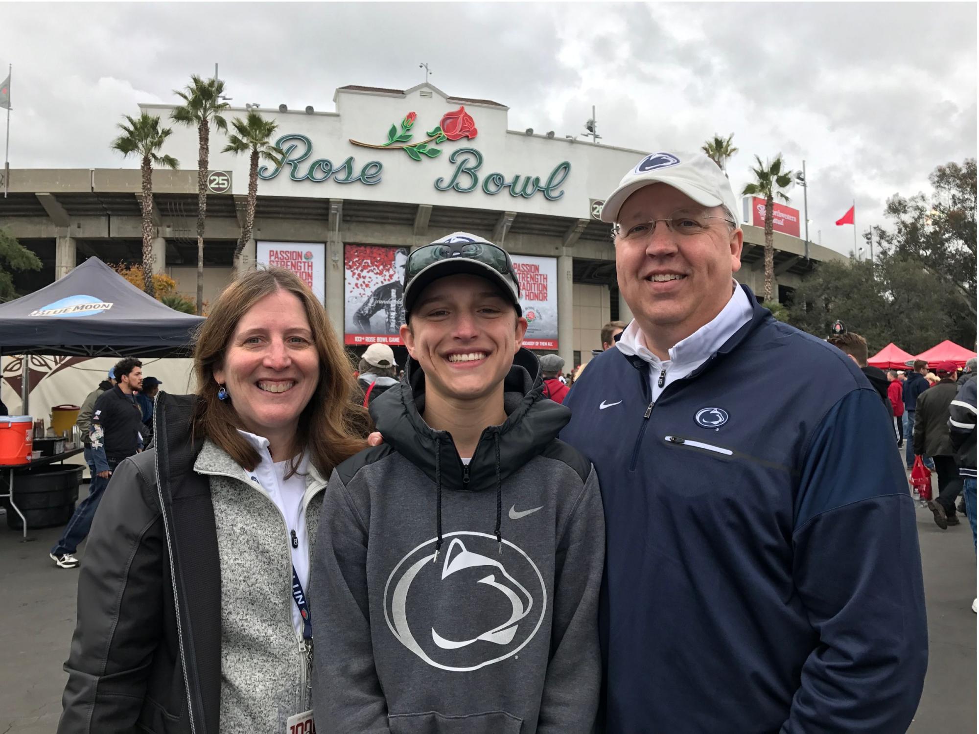 parents and son in penn state gear at rose bowl