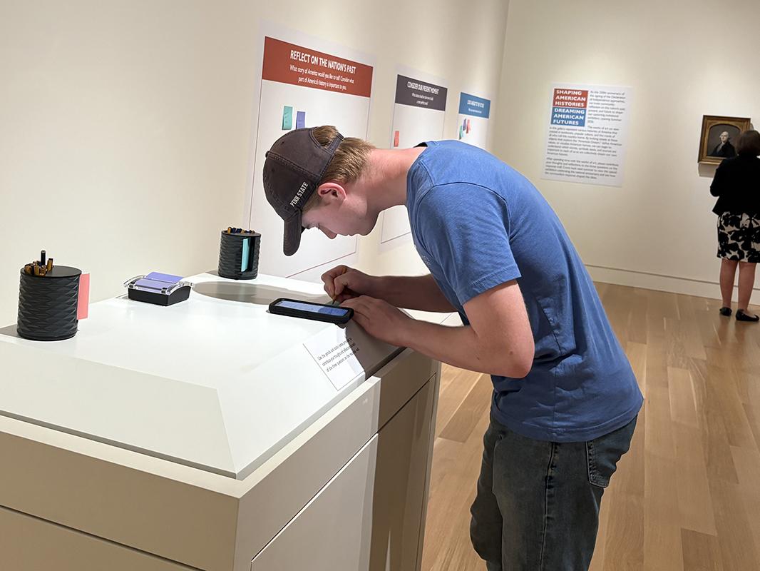 A person leaning over and writing for a prompt