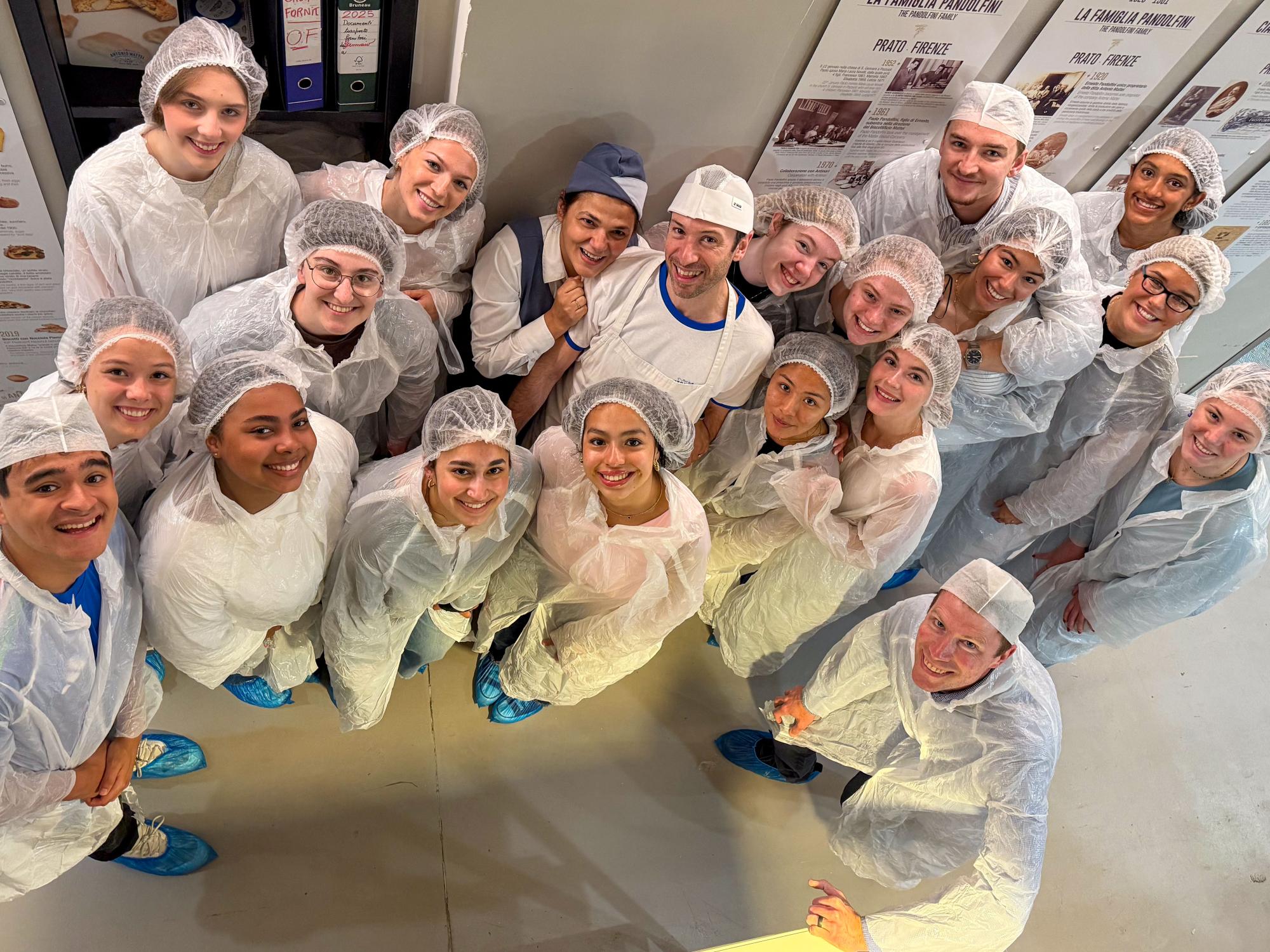 Penn State students wear disposable lab coats and shoe covers while touring the Antonio Mattei Biscotti Factory in Prato, Italy.