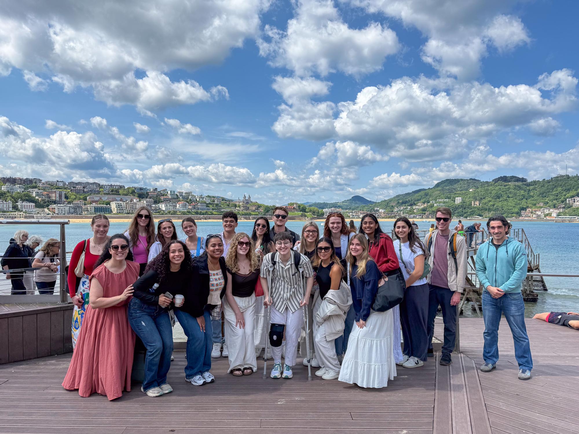Penn State students stand along the shoreline in San Sebastián, Spain.