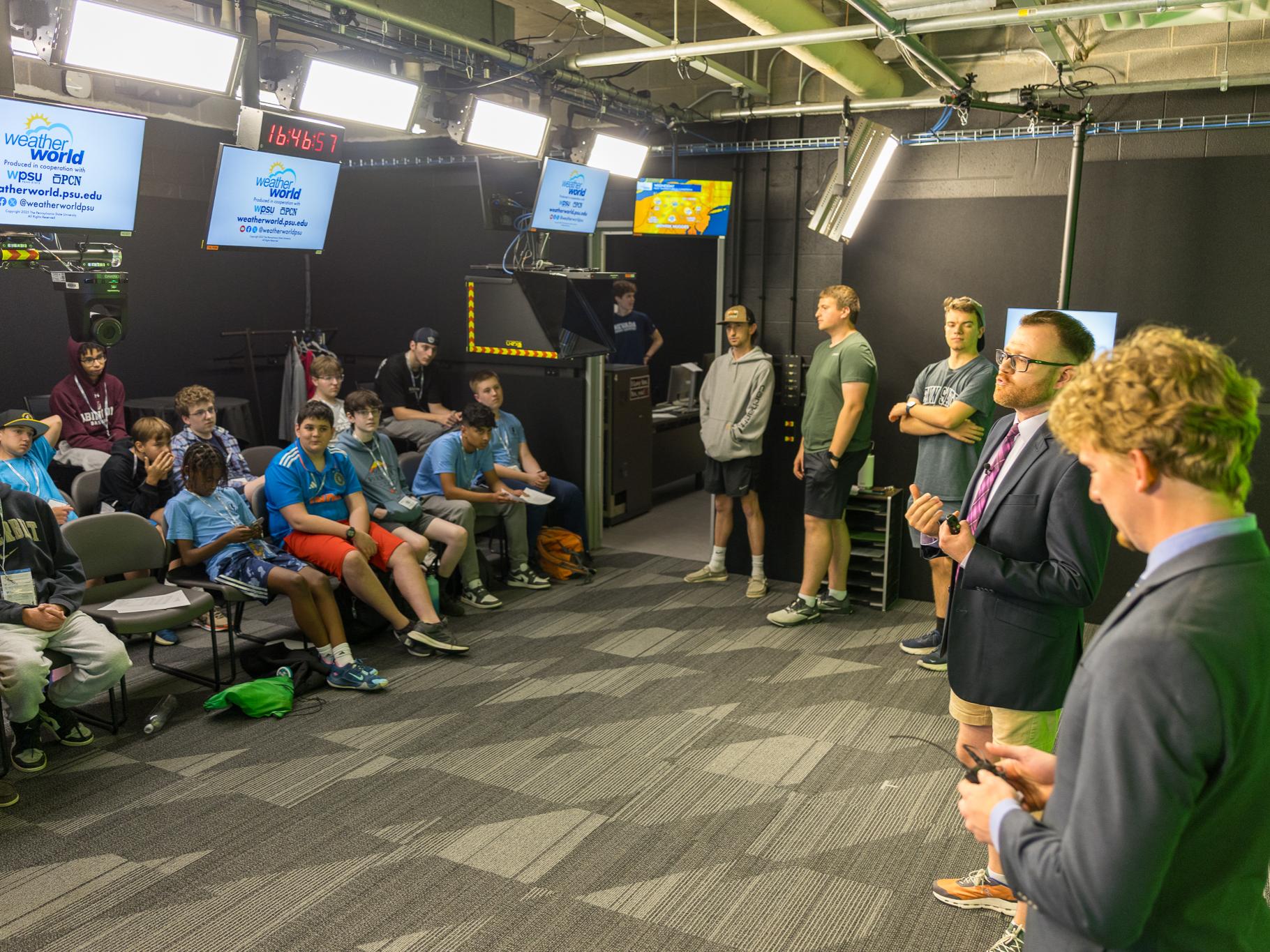 Campers ask questions after an airing of Weather World