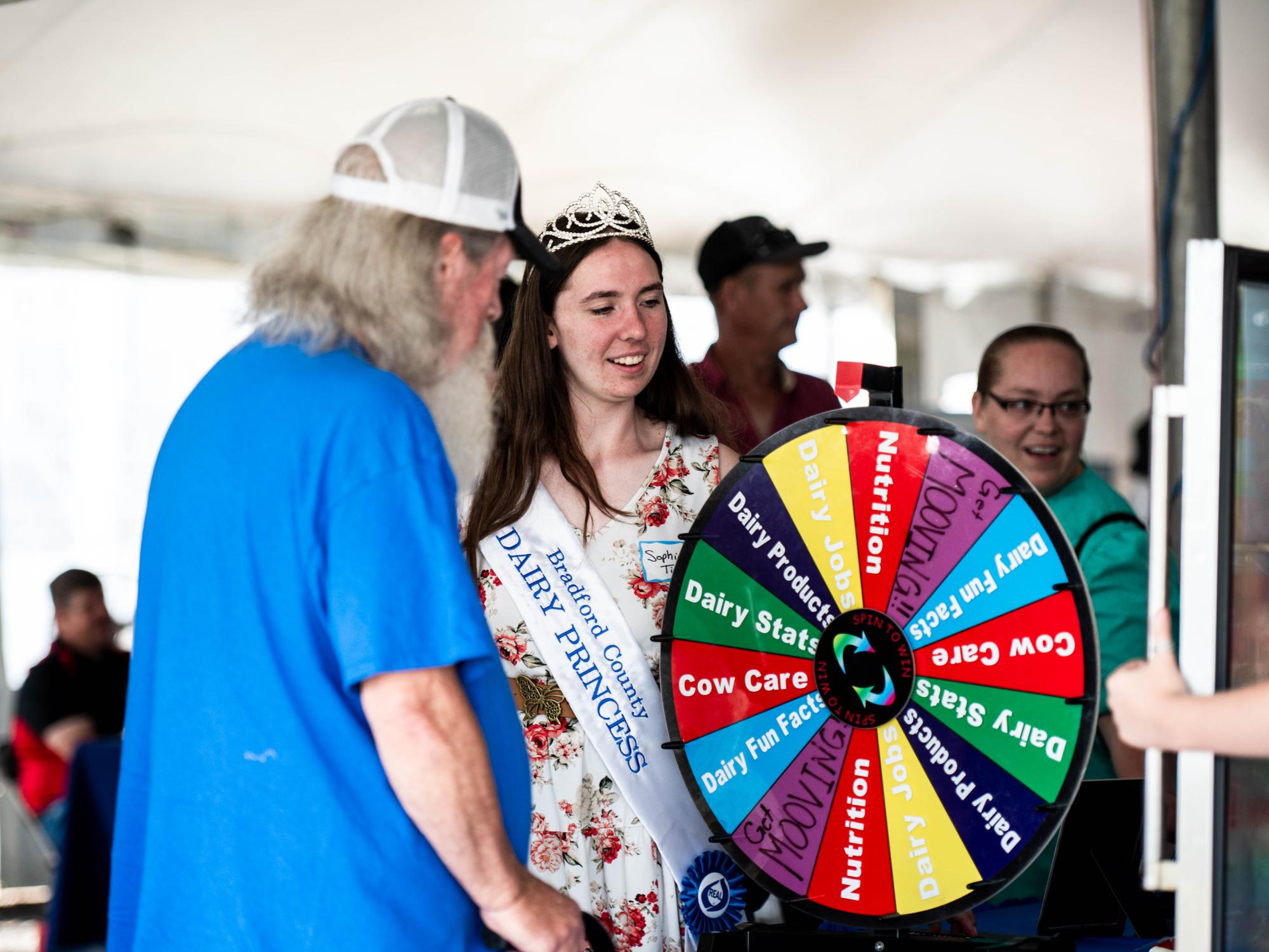 dairy princess speaking to a visitor 