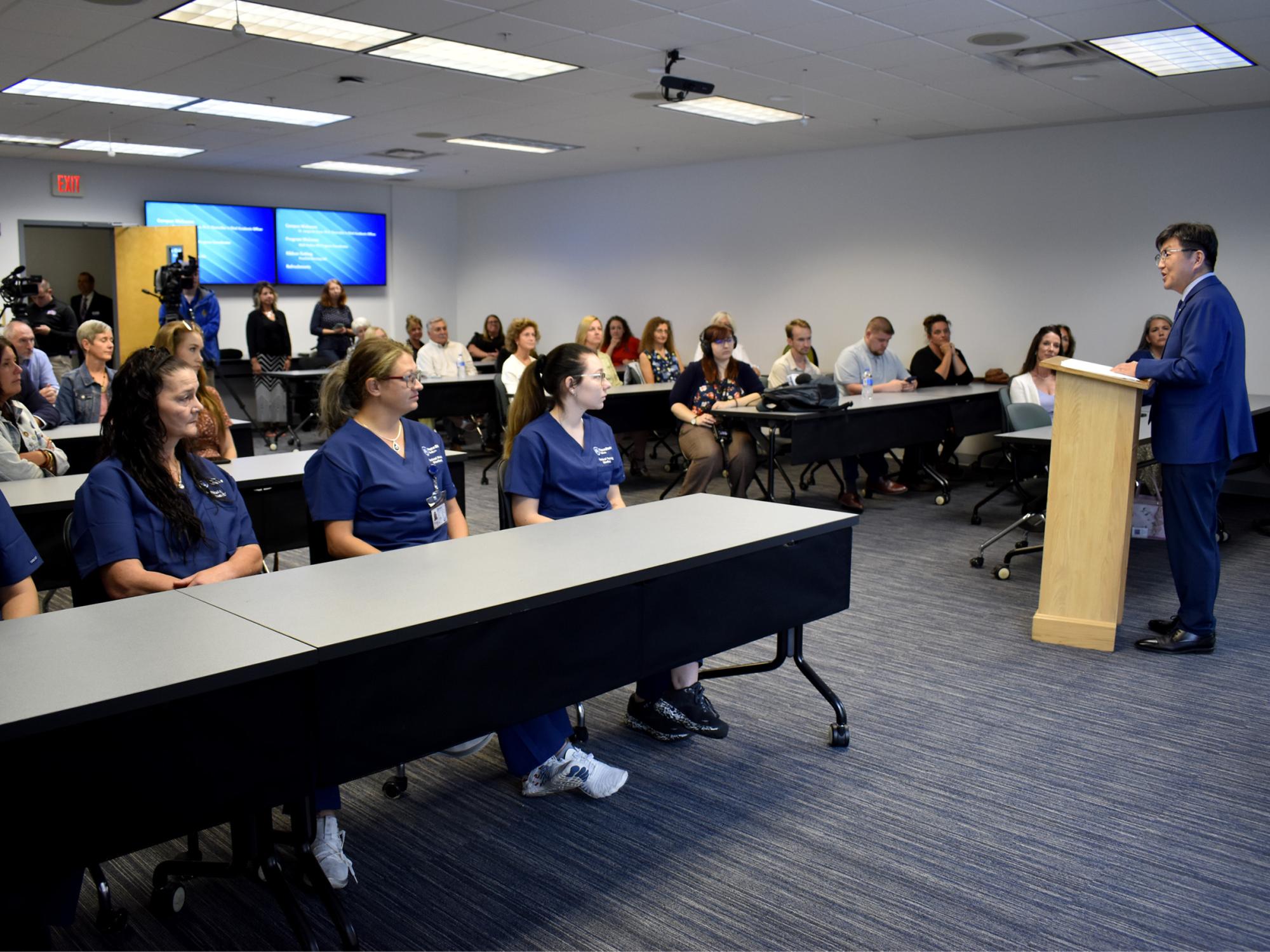 Jungwoo Ryoo, chancellor and chief academic officer, speaks to a full room at Penn State DuBois during the ribbon cutting ceremony for the practical nursing program.
