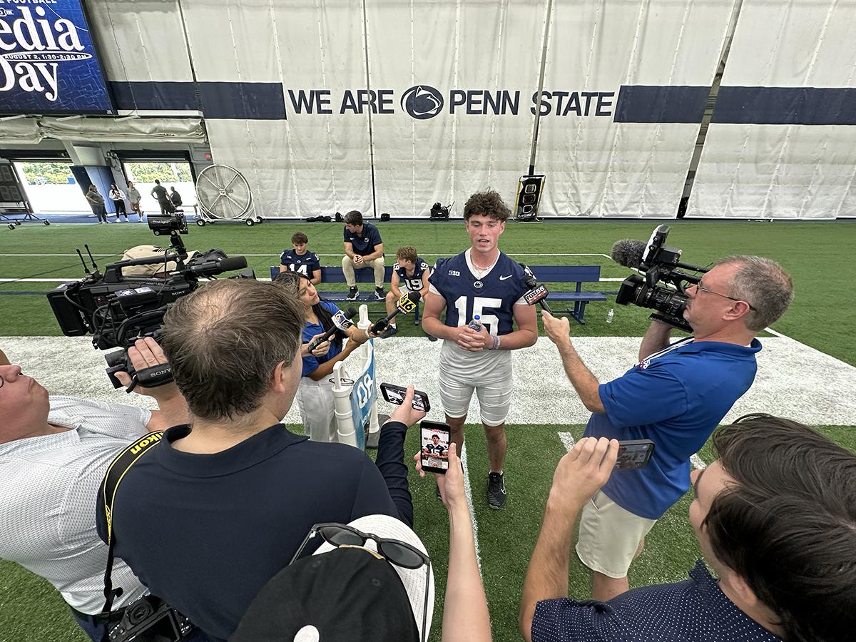 Drew Allar answers questions surrounded by media