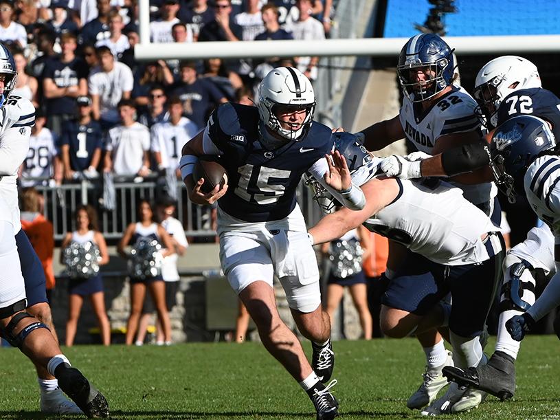 Quarterback Drew Allar rushes ball