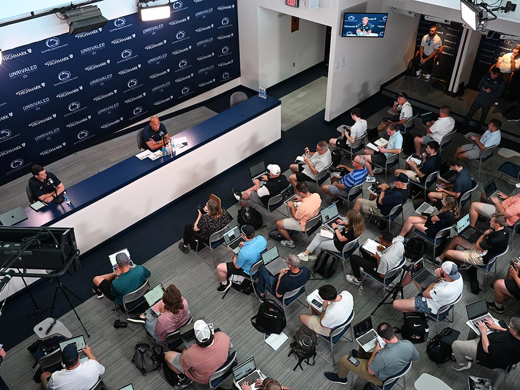 Aerial view of James Franklin press conference speaking to media