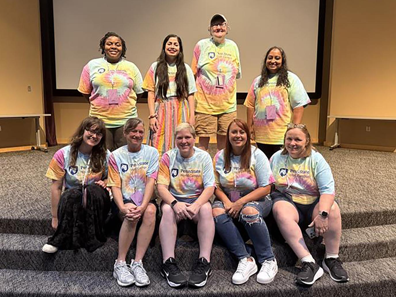 A group of people wearing tie-dye T-Shirts.