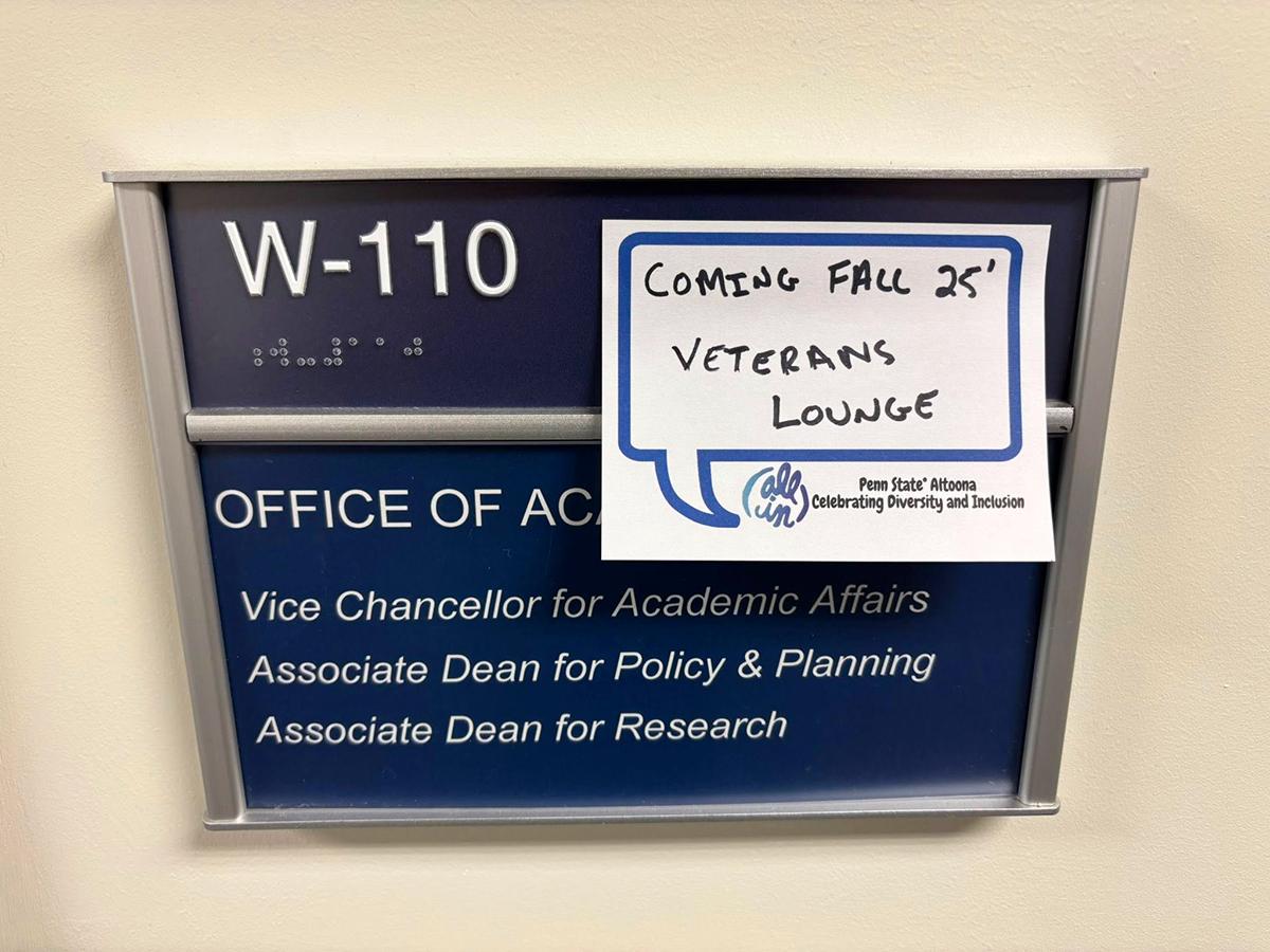 An office marker for the office of Academic Affairs with a sticky note over it indicating the location of the new Veterans Lounge, launching in fall 2025.
