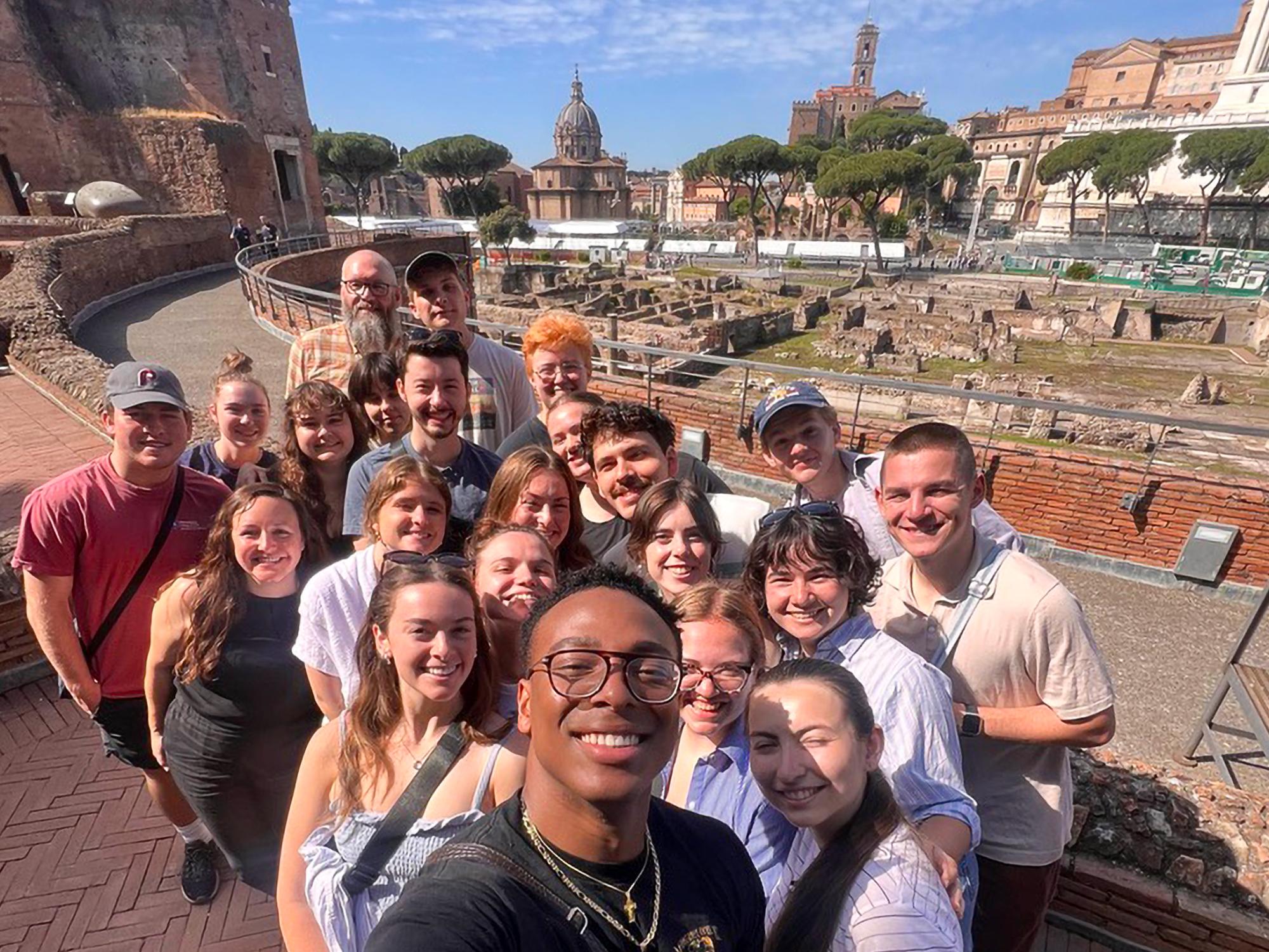 A group of Penn State students takes a selfie at Trajan's Market in Rome.