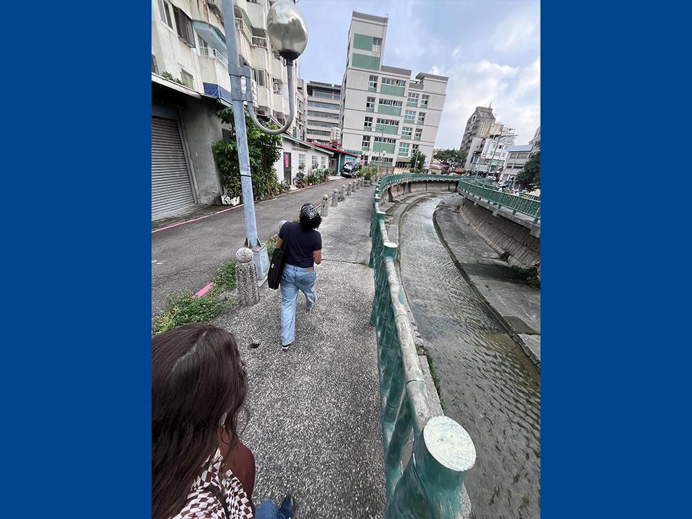 Two students walking through the streets of Taiwan