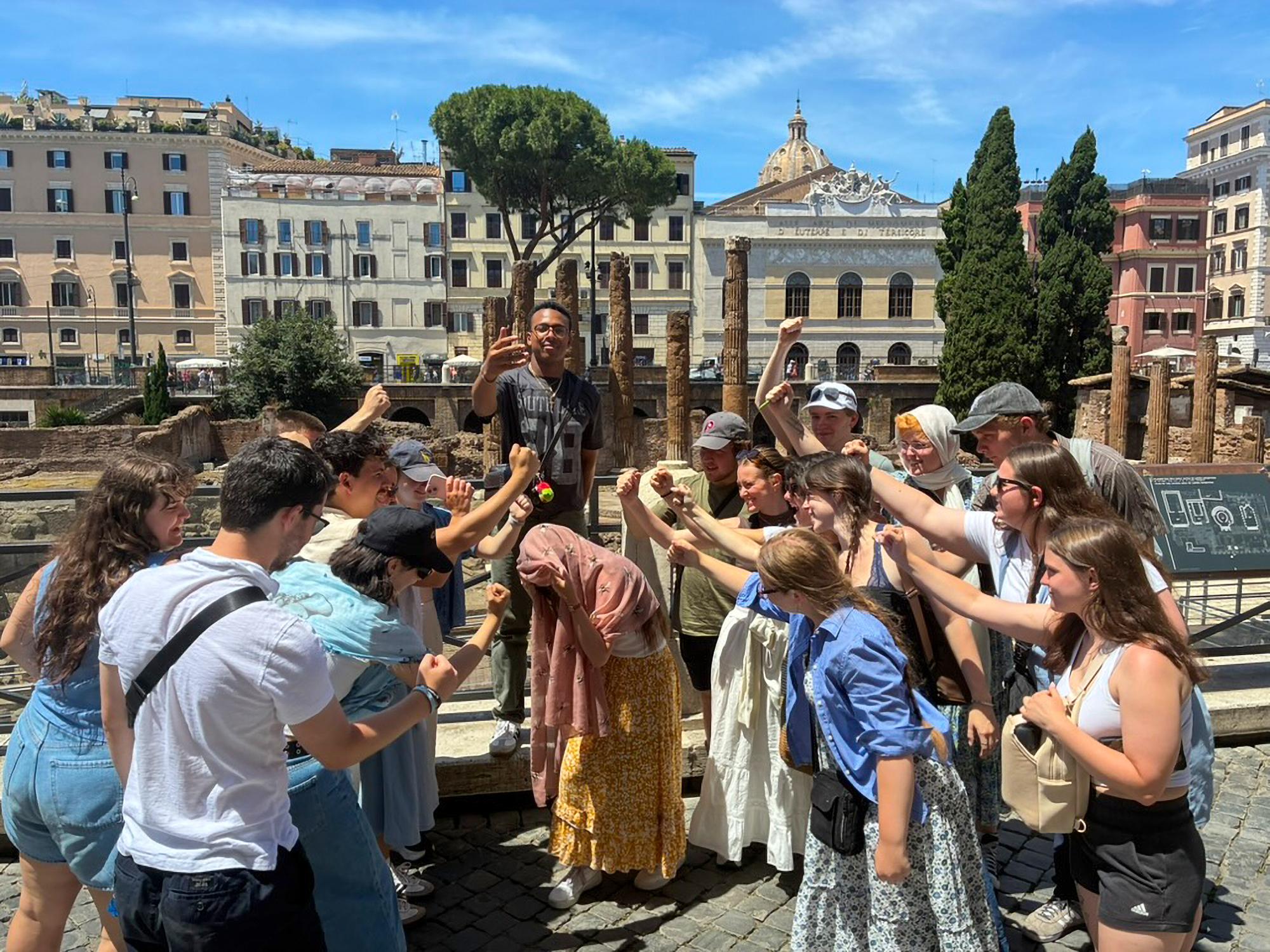 A group of students reenact the assassination of Julius Caesar at the Largo di Torre Argentina in Rome.