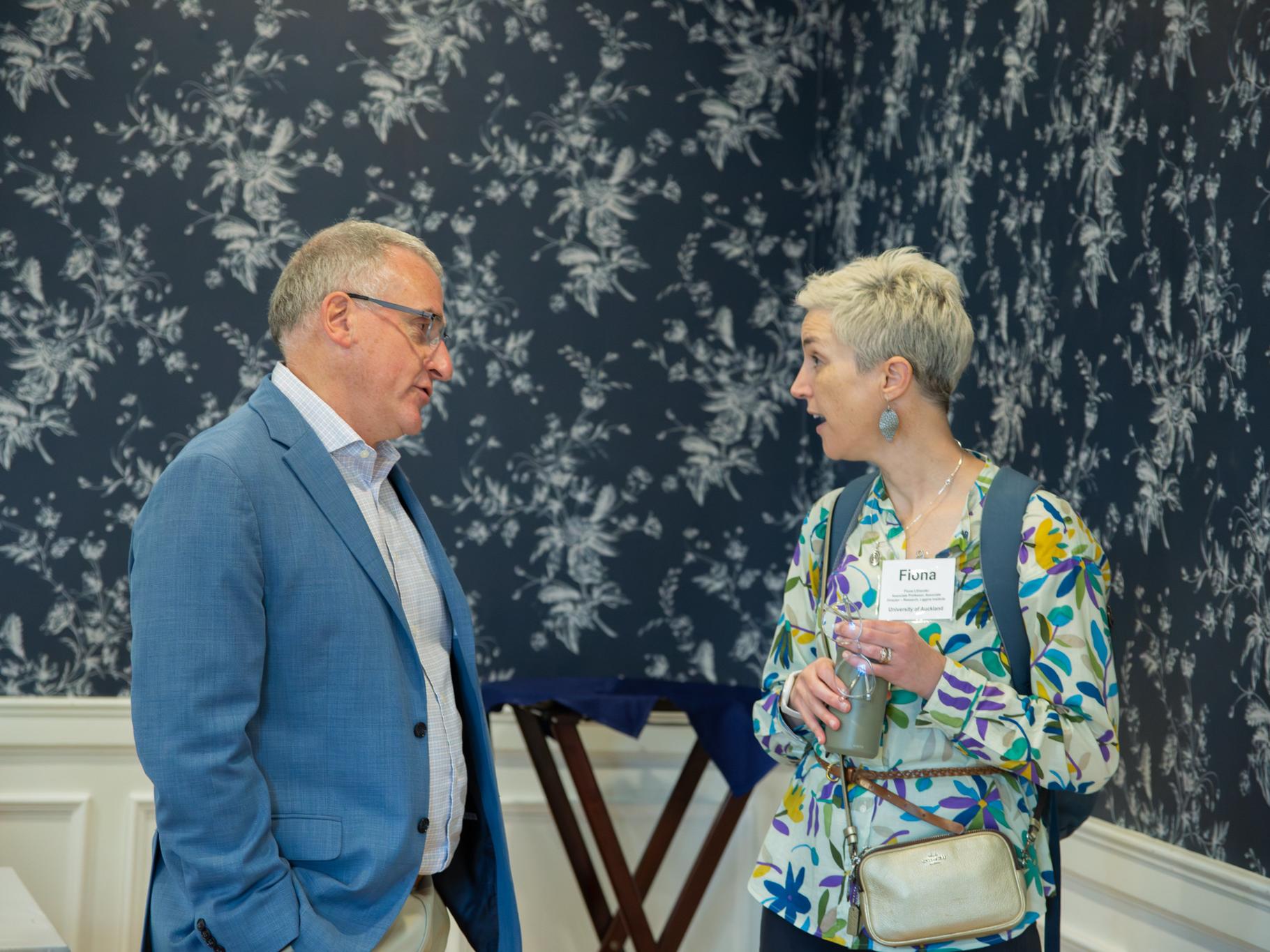 Two people engaged in conversation