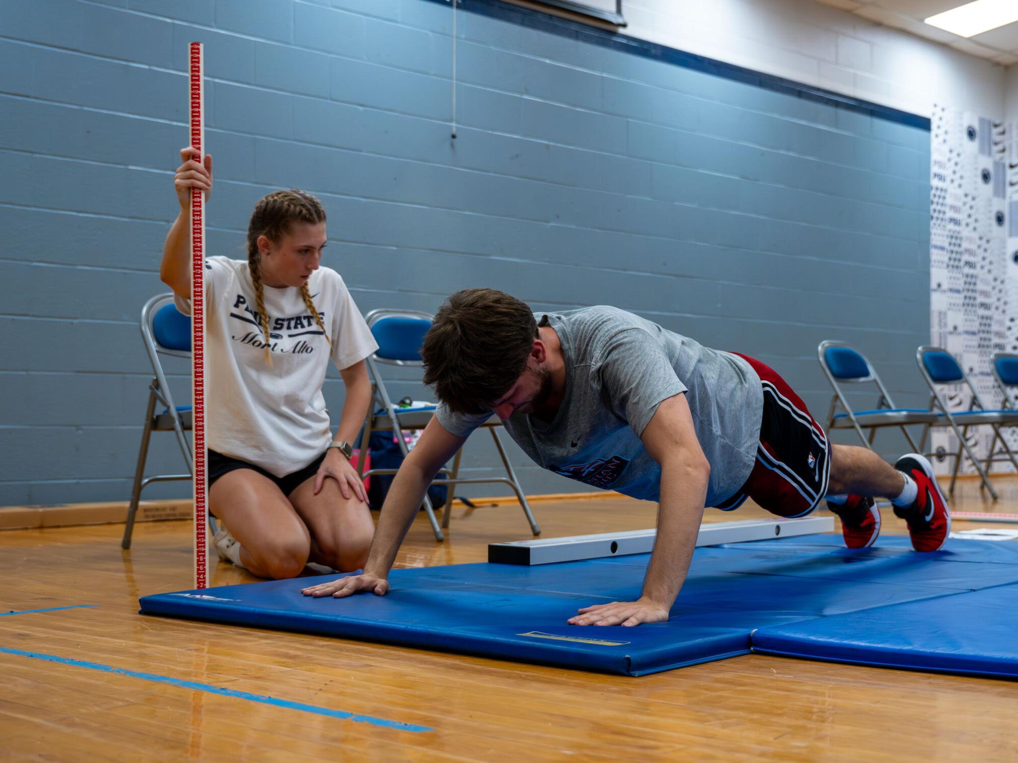 Student-athlete completes push-up as part of a Functional Movement Screening