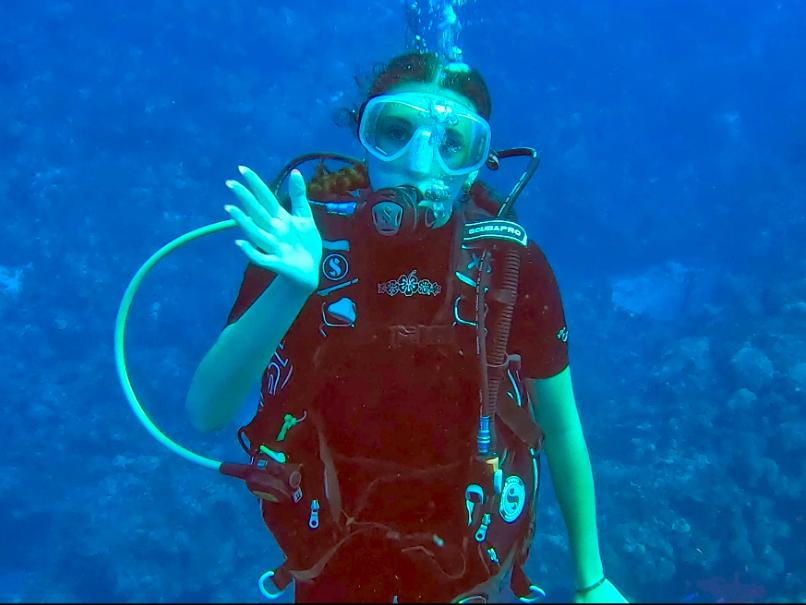 Hailey Piccirillo in scuba gear in the ocean at Grand Cayman