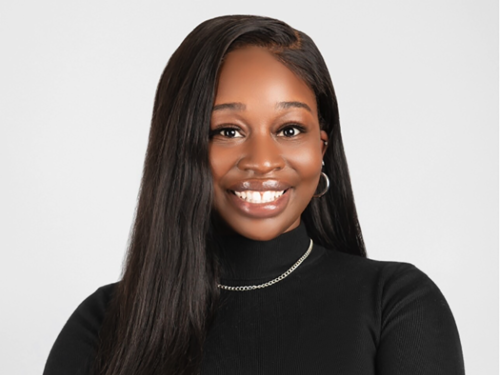 A professional headshot of Malaysia Wallace