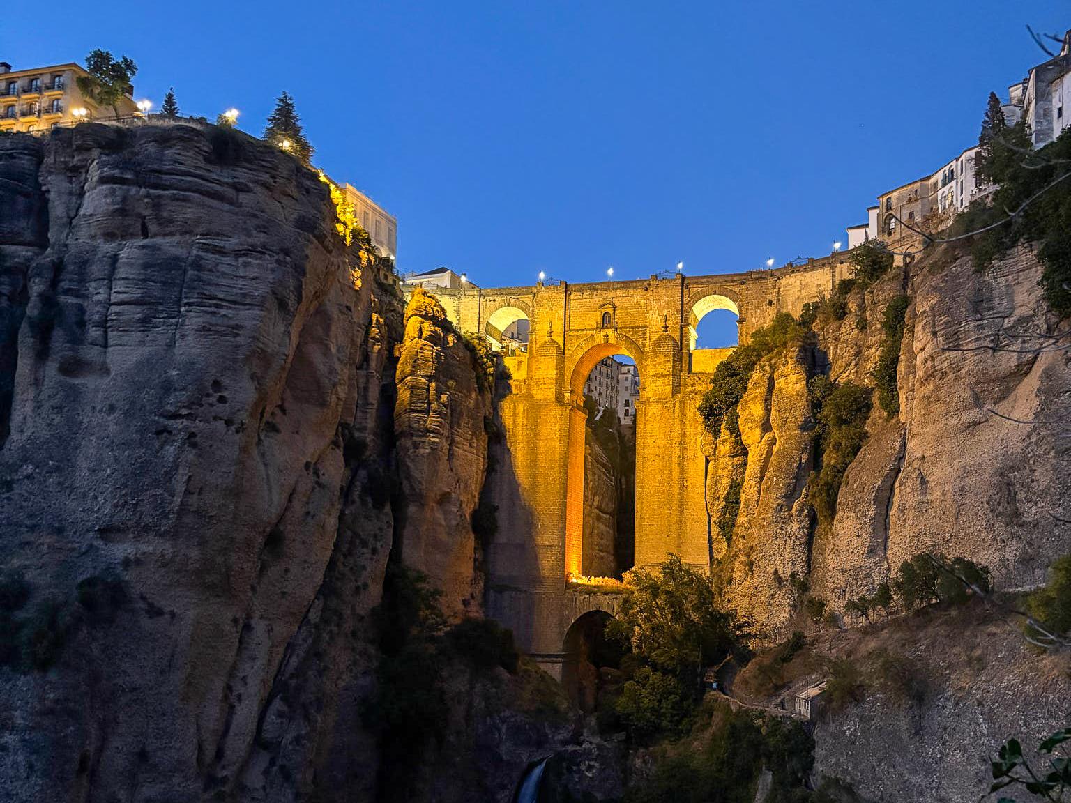 A scenic view of the Puente Nuevo bridge spanning the gorge in Ronda, Spain.